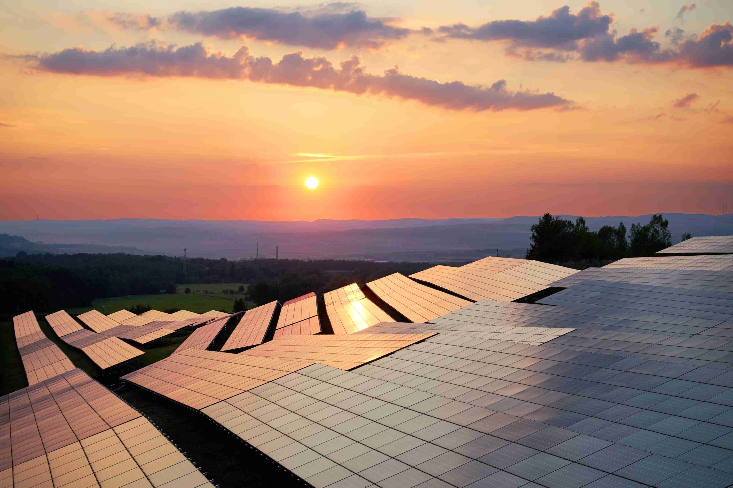 iStock 683109036 Photovoltaic panels of solar power station at sunset