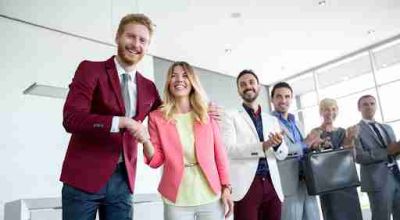 Satisfied director congratulate to his female employer